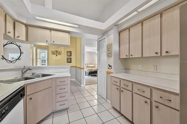 a view of a livingroom with a furniture wooden floor and a chandelier