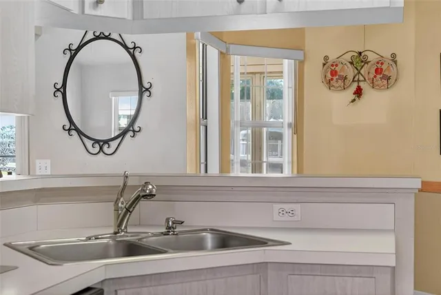 a view of a room with window and wooden floor