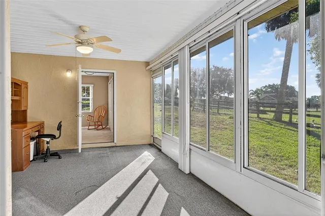 a bathroom with a granite countertop toilet a sink and a mirror