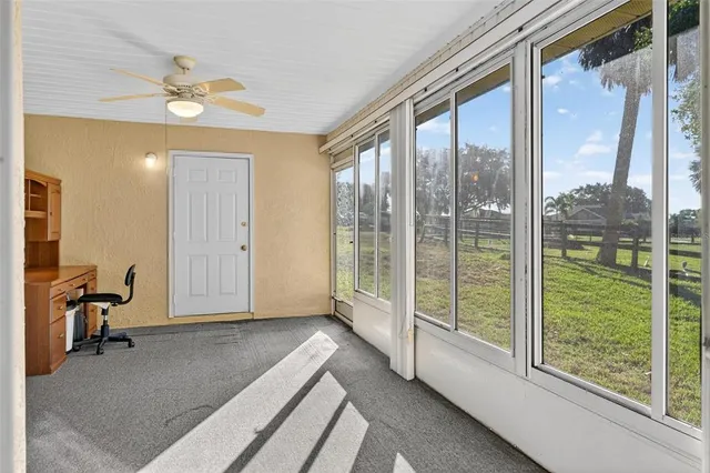 a bathroom with a granite countertop sink and mirror