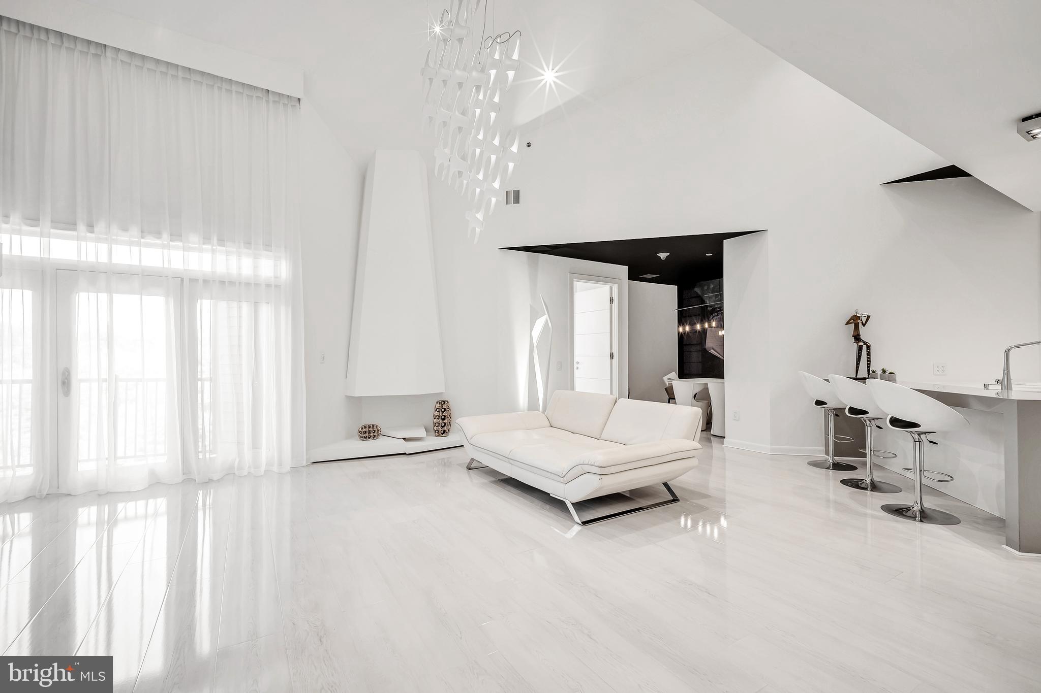 554 Carson Terrace Huntingdon Valley, PA 19006 - Photo 12 of 39 a living room with furniture and a chandelier