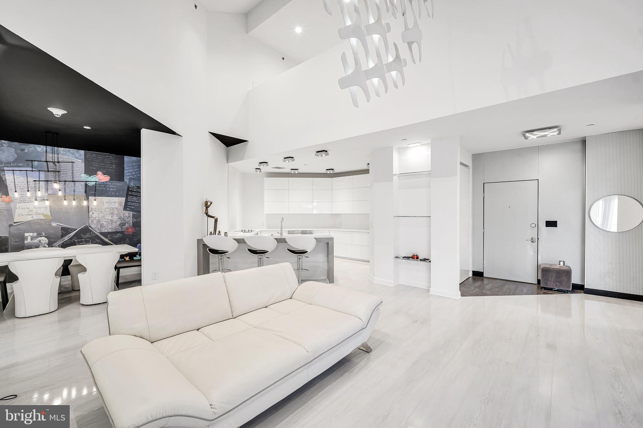 554 Carson Terrace Huntingdon Valley, PA 19006 - Photo 13 of 39 a living room with furniture a large window and white doors