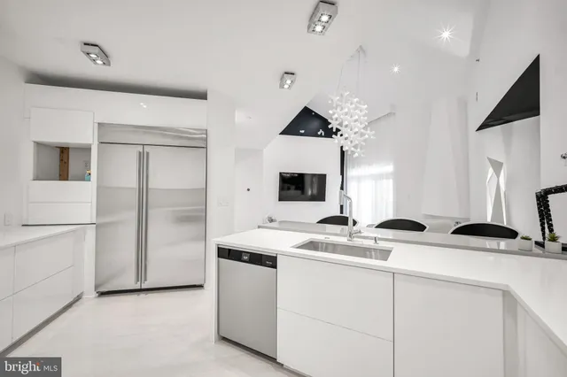 a bathroom with a sink double vanity and a mirror