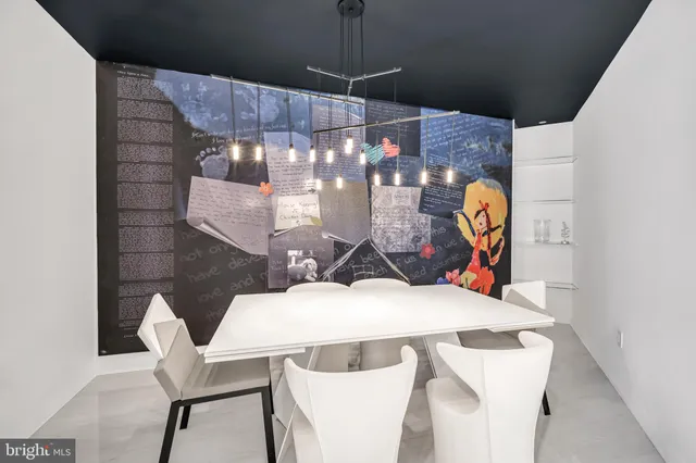 a view of a dining room with furniture and chandelier