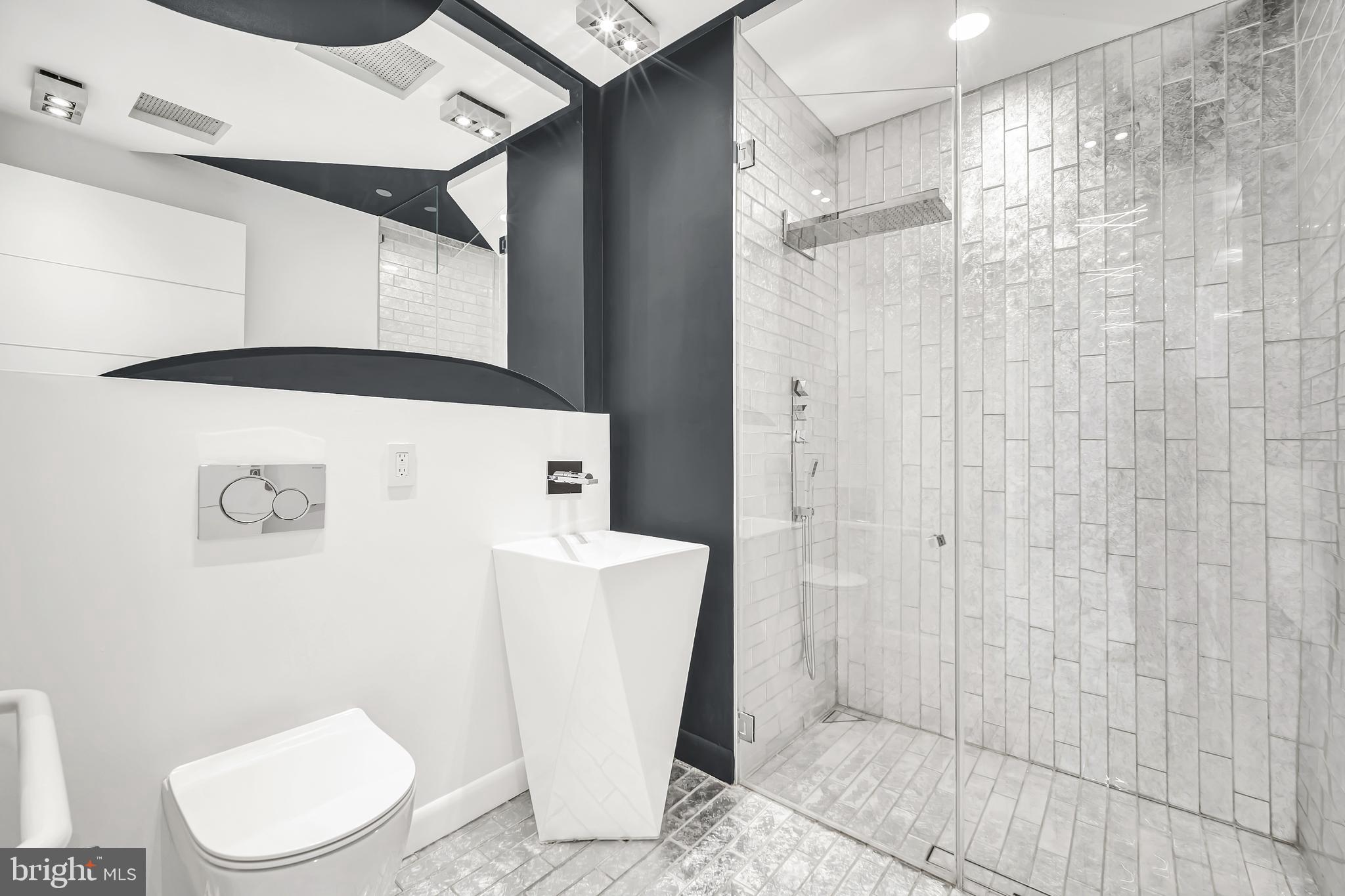 554 Carson Terrace Huntingdon Valley, PA 19006 - Photo 30 of 39 a white toilet sitting next to a bathroom sink