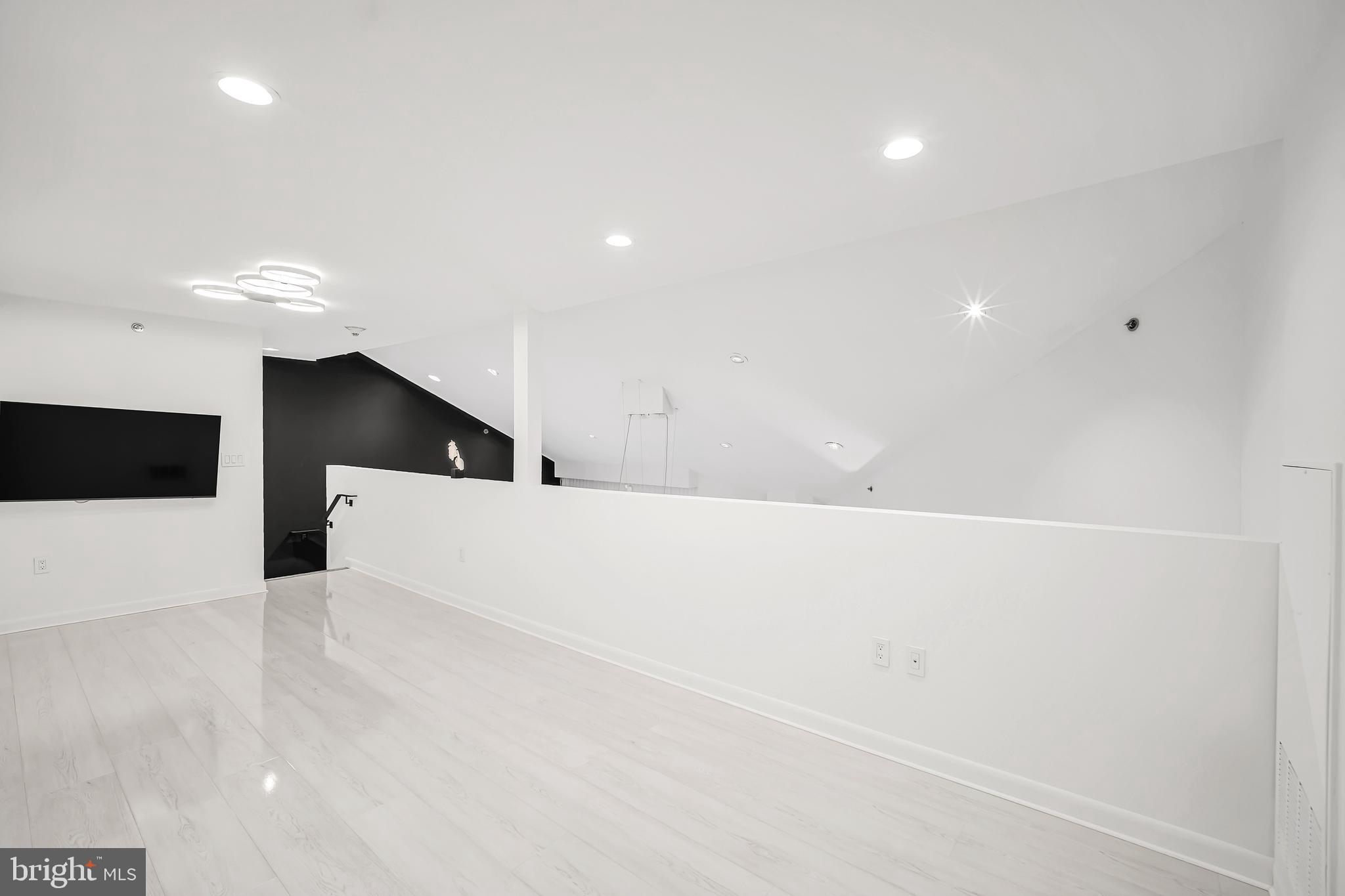 554 Carson Terrace Huntingdon Valley, PA 19006 - Photo 33 of 39 a view of an empty room with wooden floor