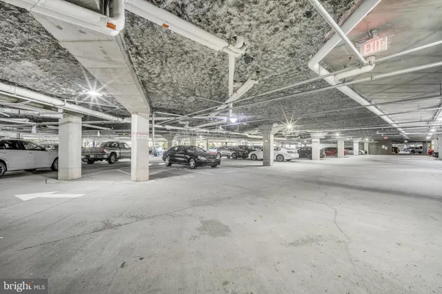 a view of parking garage with cars