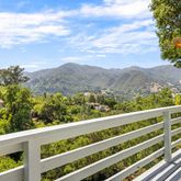 a view of a two chairs in the roof deck