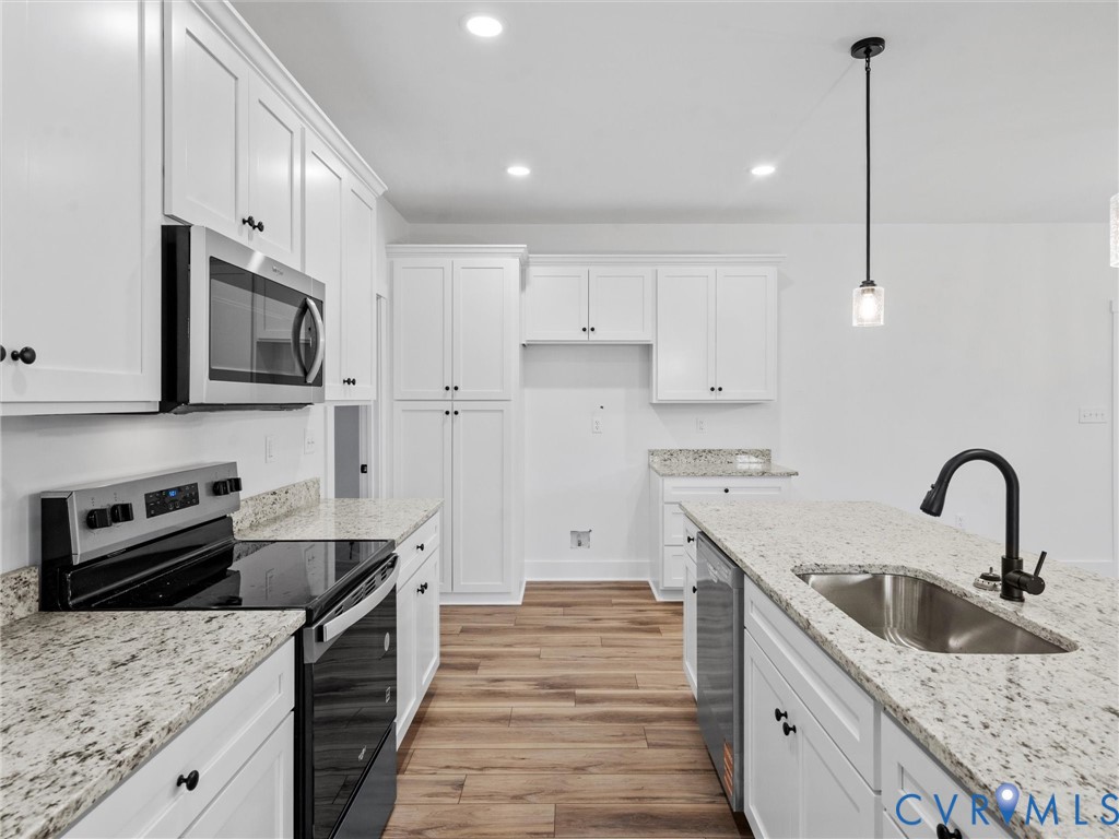 3289 Cumberland Road Cumberland, VA 23040 - Photo 12 of 29 a kitchen with granite countertop a sink stainless steel appliances and cabinets