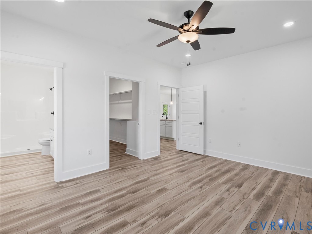 3289 Cumberland Road Cumberland, VA 23040 - Photo 15 of 29 an empty room with wooden floor ceiling fan and window