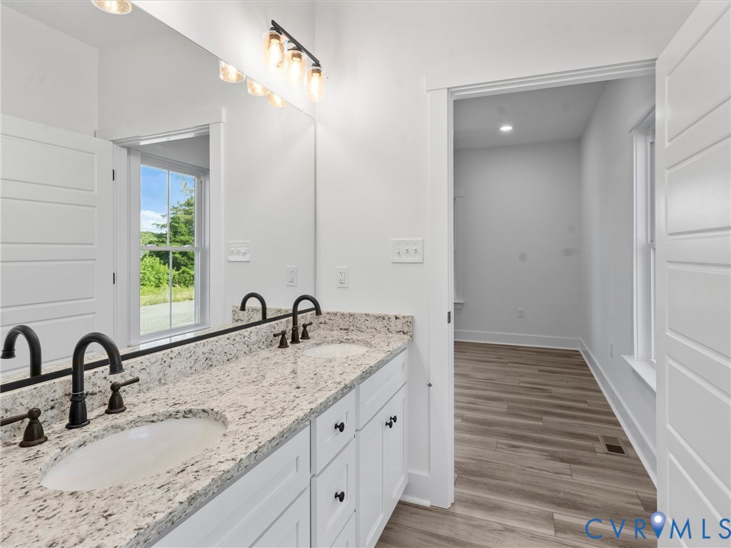 3289 Cumberland Road Cumberland, VA 23040 - Photo 19 of 29 a bathroom with double sink and a mirror