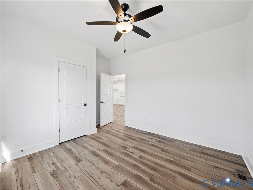3289 Cumberland Road Cumberland, VA 23040 - Photo 21 of 29 wooden floor in an empty room