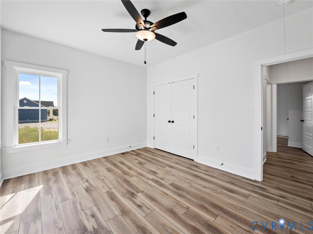 3289 Cumberland Road Cumberland, VA 23040 - Photo 26 of 29 wooden floor in an empty room with a window