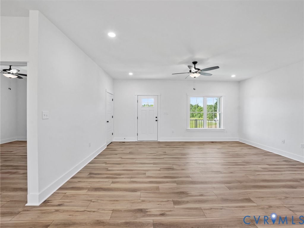 3289 Cumberland Road Cumberland, VA 23040 - Photo 4 of 29 wooden floor in an empty room with a window