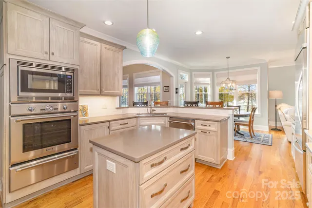 a kitchen with a stove a sink and a refrigerator