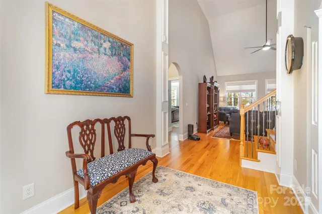 a bedroom with furniture and a rug