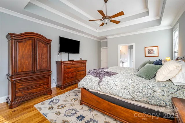 a bedroom with a bed and flat screen tv