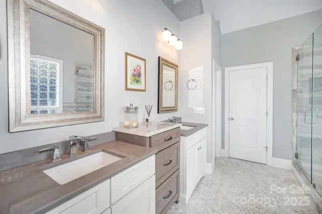 a spacious bathroom with a double vanity sink mirror and