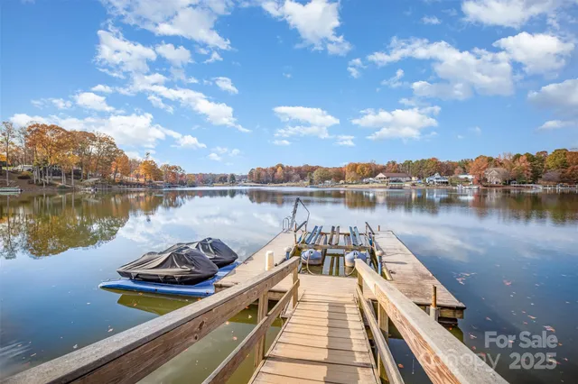 a view of a lake with houses in the background