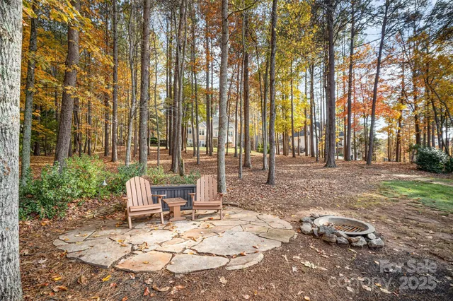 a view of backyard with a table and chairs