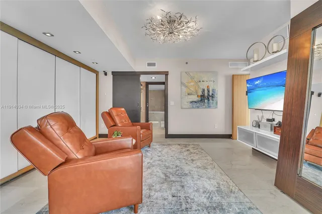 a living room with furniture flowerpot and window