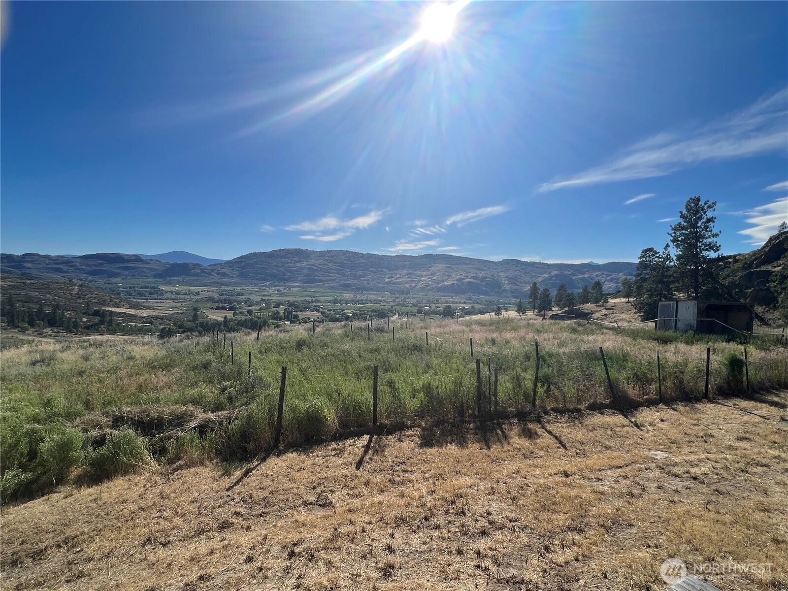 105 Swanson Mill Road Oroville, WA 98844 - Photo 19 of 37 a view of a lake with a mountain in the background