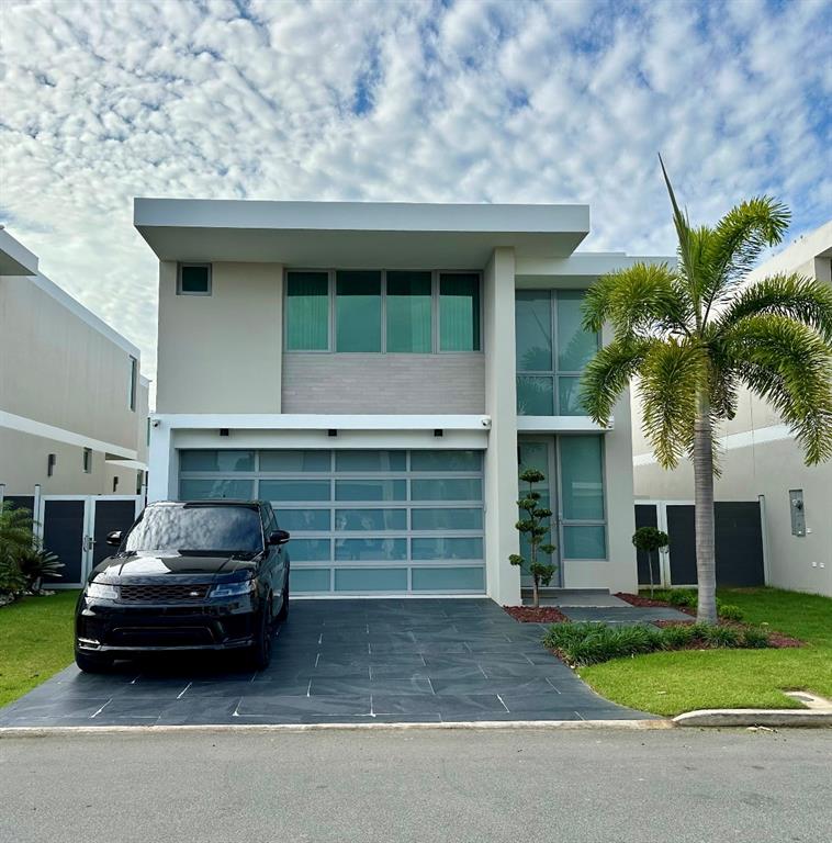 68 Riviera Village Bayamon, PR 00959 - Photo 1 of 14 a car parked in front of a house