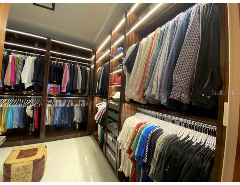 68 Riviera Village Bayamon, PR 00959 - Photo 11 of 14 a view of walk in closet with clothes and shoes