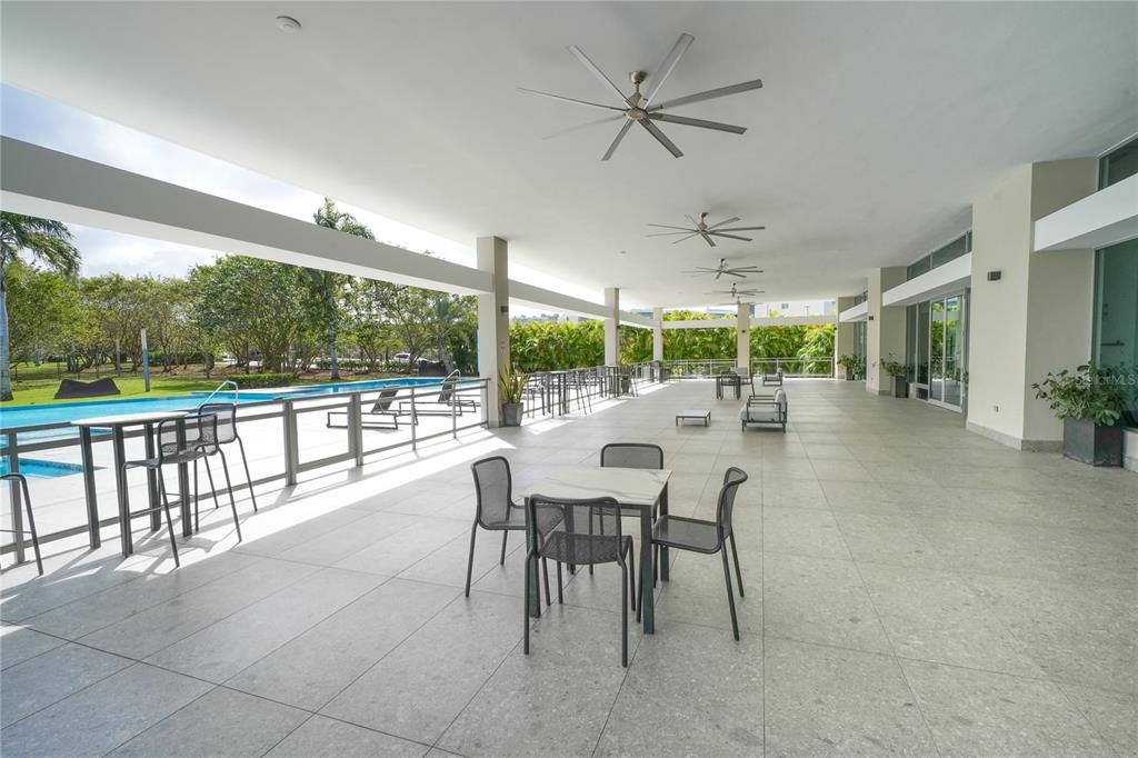 68 Riviera Village Bayamon, PR 00959 - Photo 13 of 14 a outdoor space with lots of tables a chandelier and living room view