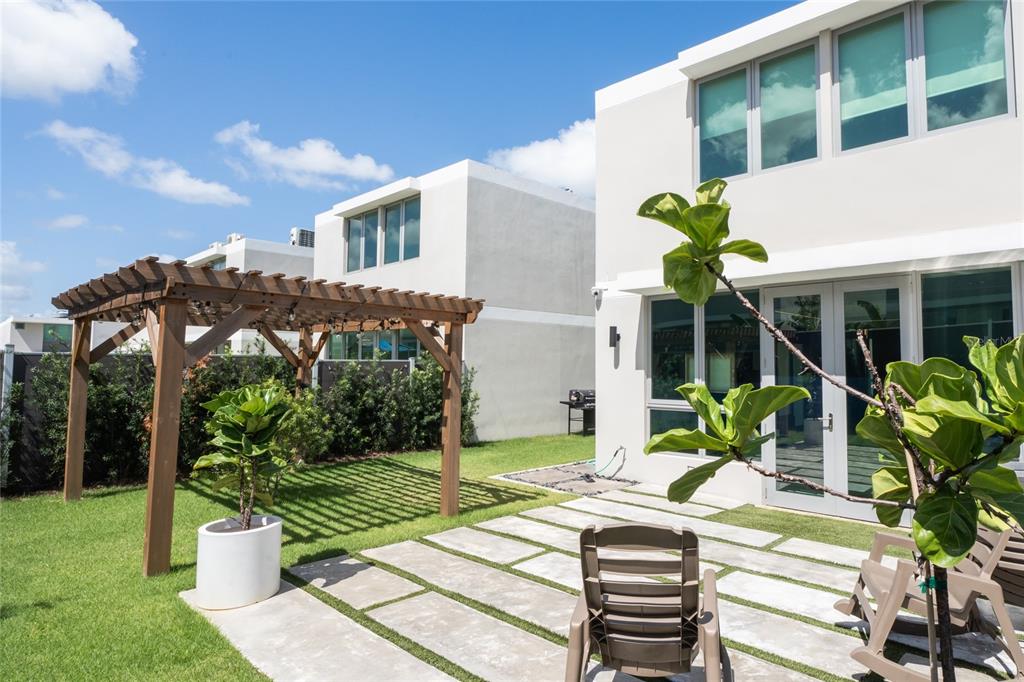 68 Riviera Village Bayamon, PR 00959 - Photo 4 of 14 a view of a house with backyard and sitting area