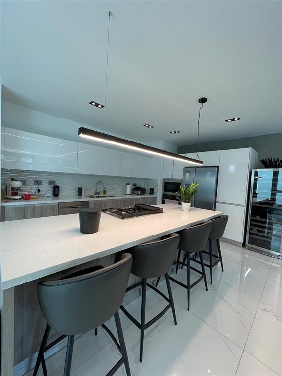 68 Riviera Village Bayamon, PR 00959 - Photo 5 of 14 a kitchen with a table and chairs in it