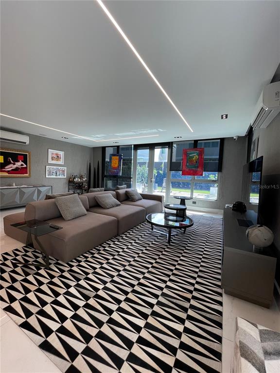 68 Riviera Village Bayamon, PR 00959 - Photo 6 of 14 a living room with furniture a coffee table and a couch