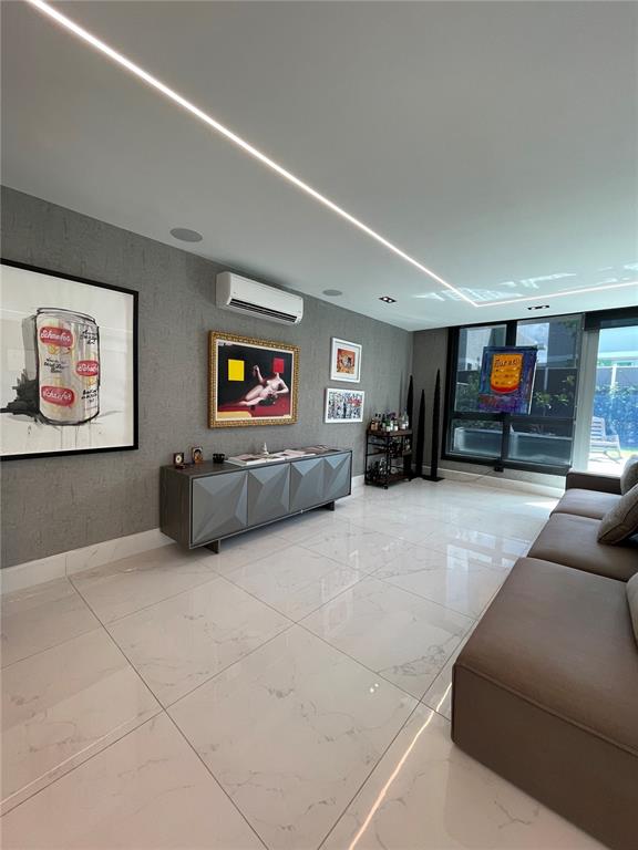 68 Riviera Village Bayamon, PR 00959 - Photo 7 of 14 a living room with furniture and a flat screen tv