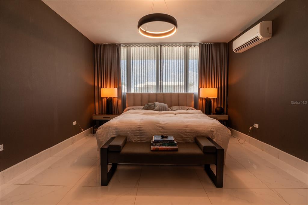 68 Riviera Village Bayamon, PR 00959 - Photo 10 of 14 a bed sitting in a bedroom next to a window