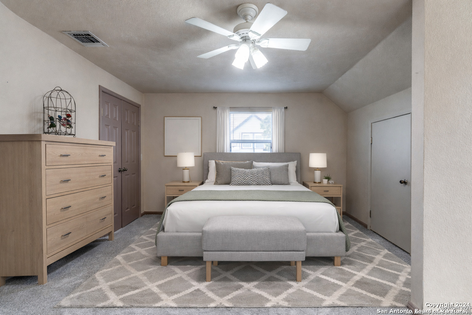 1609 Winding Creek Trail Spring Branch, TX 78070 - Photo 12 of 20 a bedroom with a bed and a chandelier