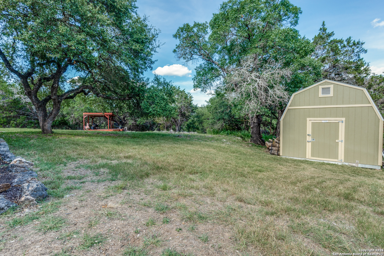 1609 Winding Creek Trail Spring Branch, TX 78070 - Photo 19 of 20 a view of a tiny house with a yard