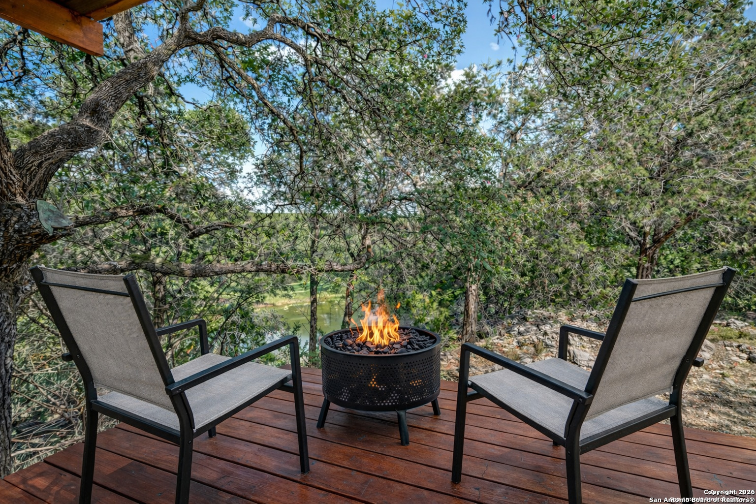 1609 Winding Creek Trail Spring Branch, TX 78070 - Photo 2 of 20 a backyard of a house with table and chairs