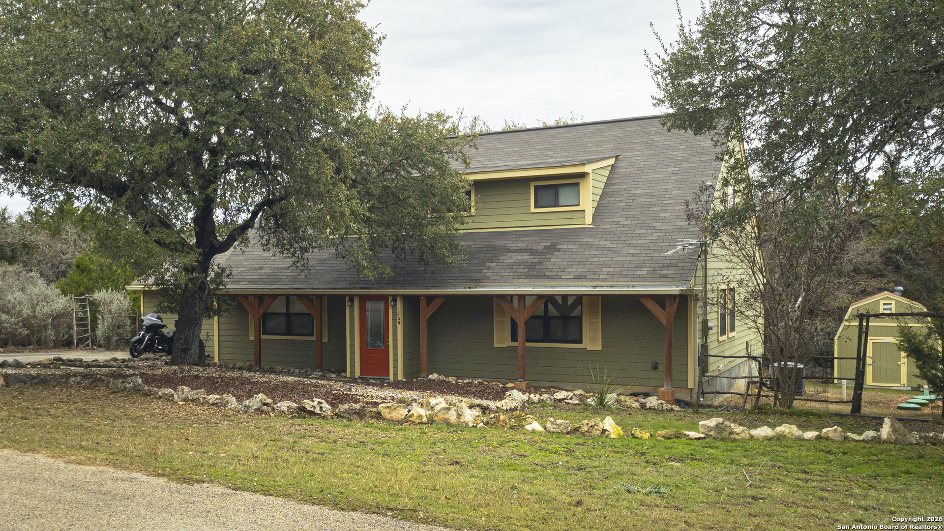 1609 Winding Creek Trail Spring Branch, TX 78070 - Photo 4 of 20 a front view of a house with a yard