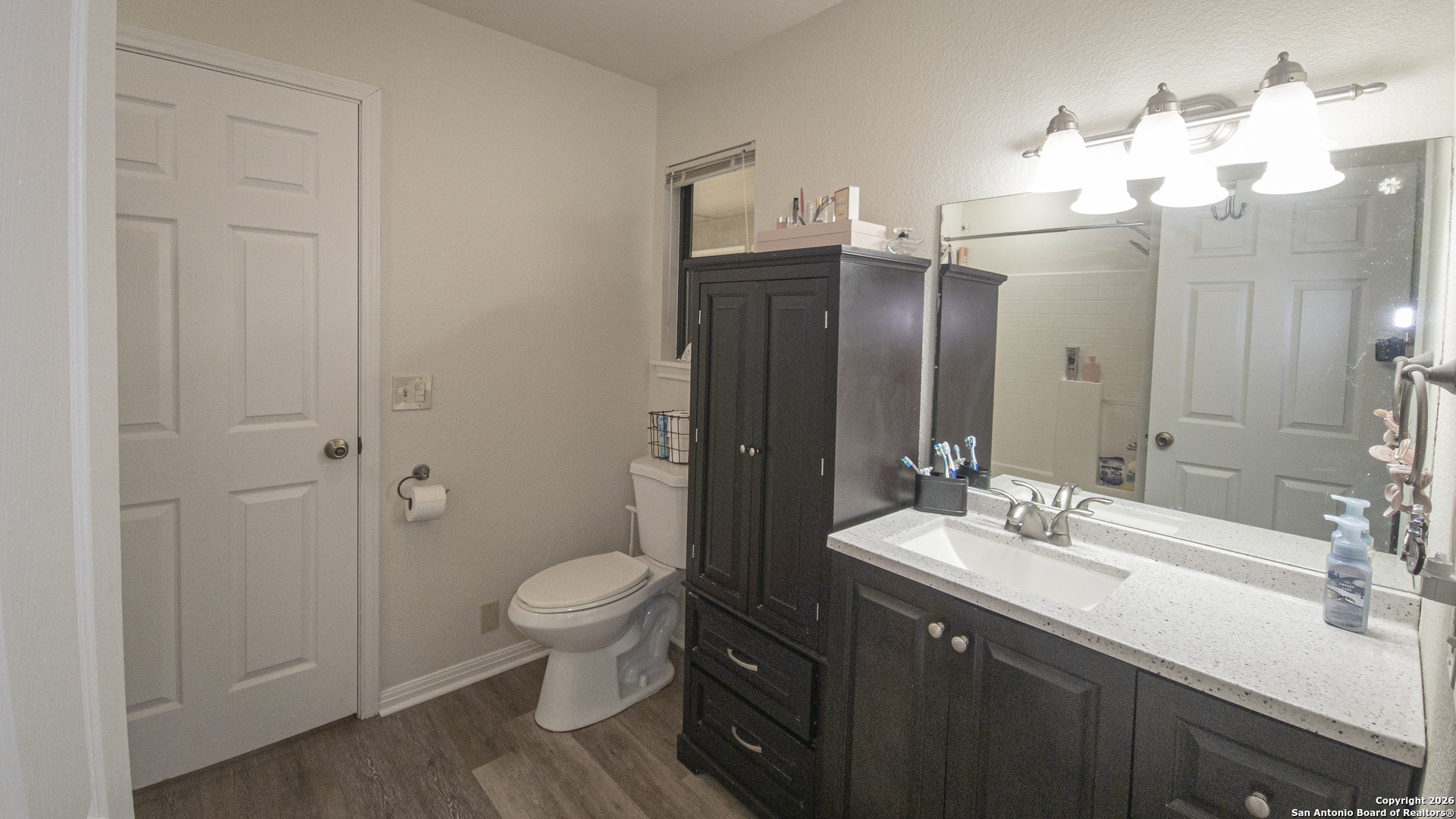1609 Winding Creek Trail Spring Branch, TX 78070 - Photo 9 of 20 a bathroom with a double vanity sink mirror and toilet