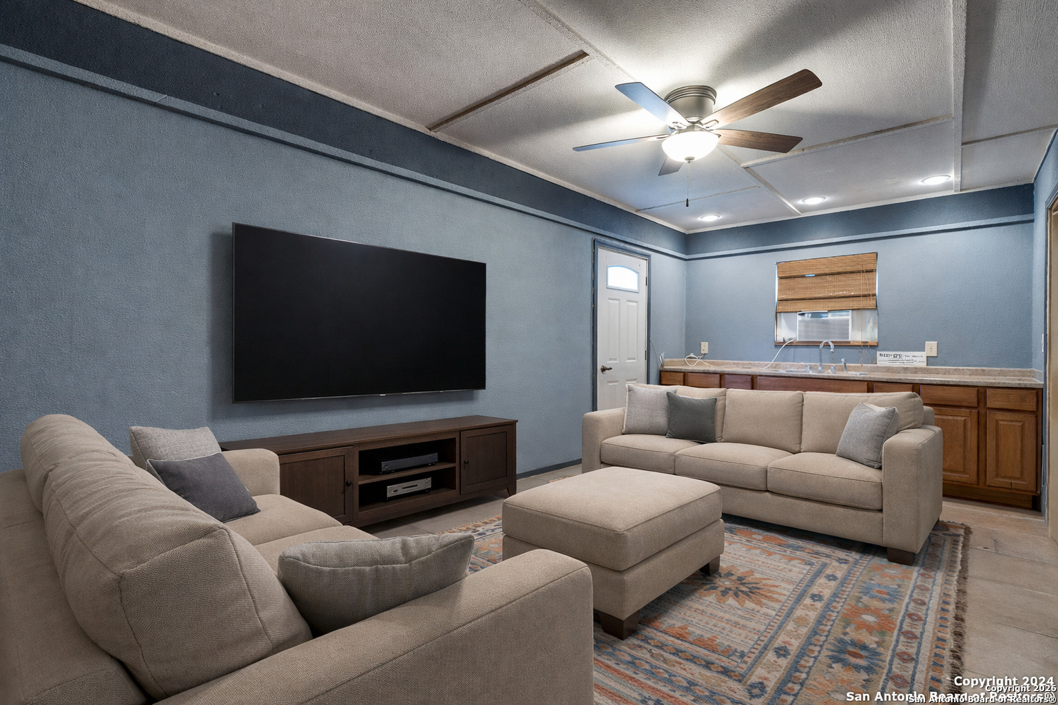 1609 Winding Creek Trail Spring Branch, TX 78070 - Photo 10 of 20 a living room with furniture and a flat screen tv
