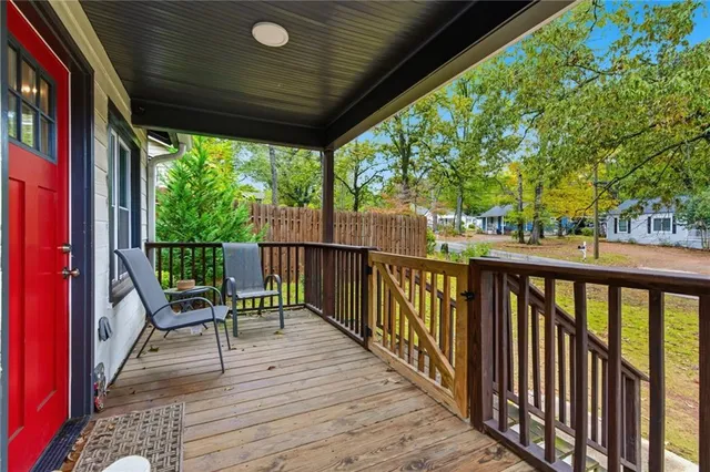 a view of a two chairs in the balcony