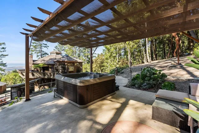 a view of a chairs and table in the patio