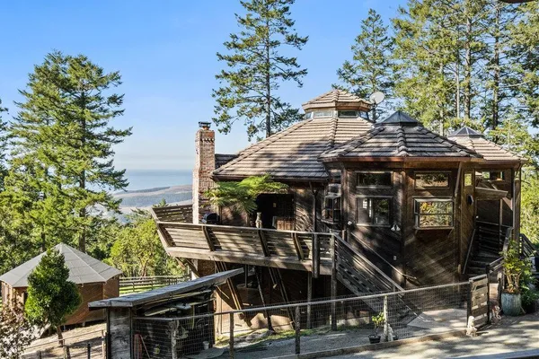 a view of a wooden door with a bench in front of it