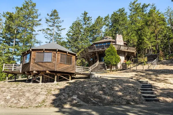 a house with trees in the background