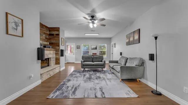 a living room with furniture and a fireplace