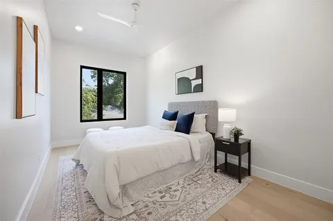 a large white bed in a white room