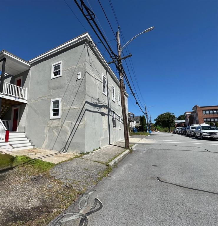 56 Whitcomb Street Webster, MA 01570 - Photo 11 of 18 a house with trees in the background