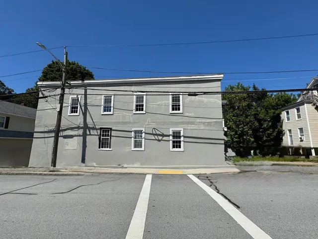 a view of a house with a street
