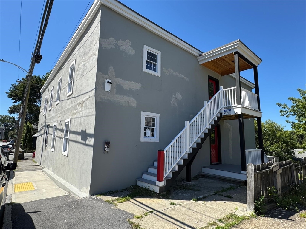 56 Whitcomb Street Webster, MA 01570 - Photo 18 of 18 a front view of a house with a yard