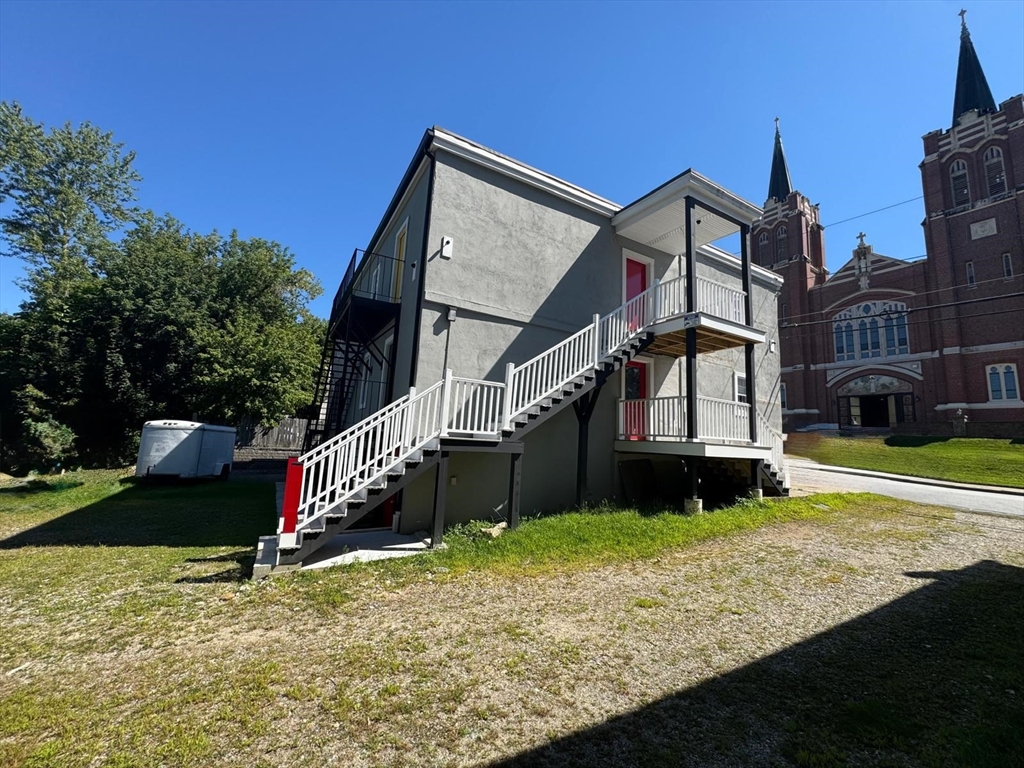56 Whitcomb Street Webster, MA 01570 - Photo 4 of 18 a view of a house with a yard